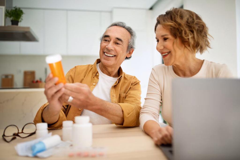 Man and woman reviewing medication bottles