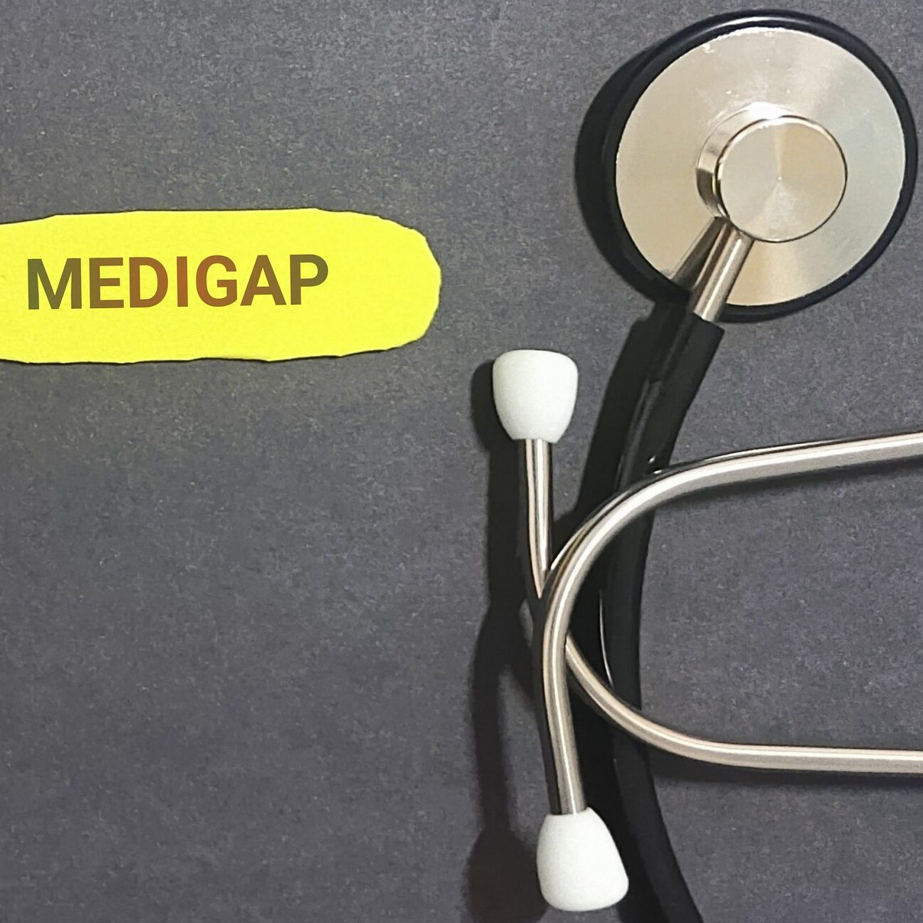 Stethoscope beside yellow MEDIGAP label